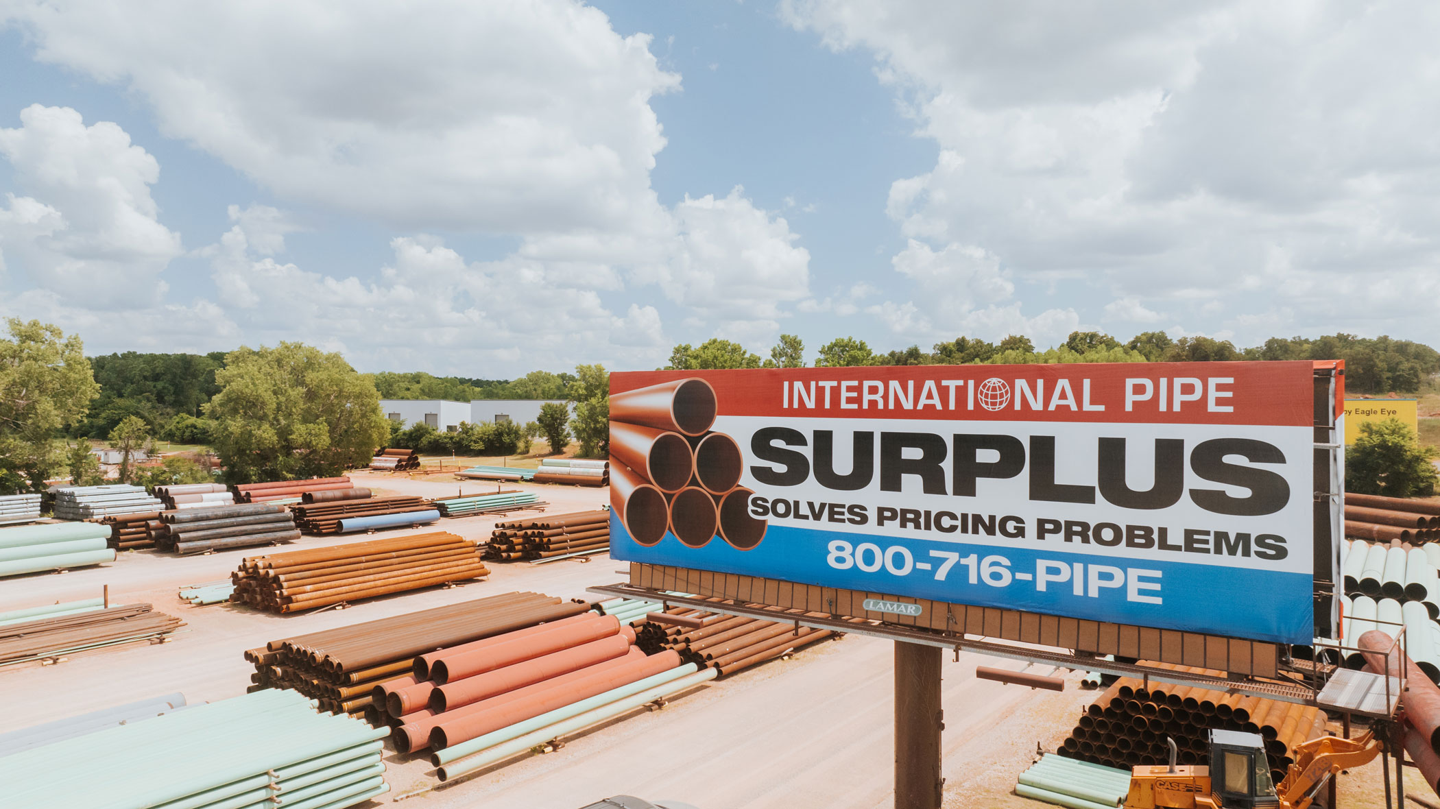 International Pipe Surplus billboard in pipe yard