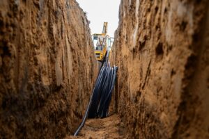 Installation,Of,Hdpe,Pipes,In,The,Trench.,The,Process,Of