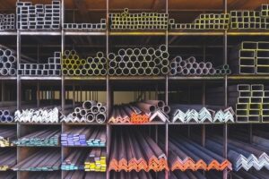 Steel,Construction,Material,Supply,Background,With,Metal,Bar,Pipe,In